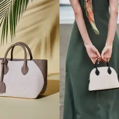 Två eleganta handväskor, en beige och brun tygväska med läderdetaljer, och en mindre vit kupolformad väska med svarta detaljer, som en baron necessär.