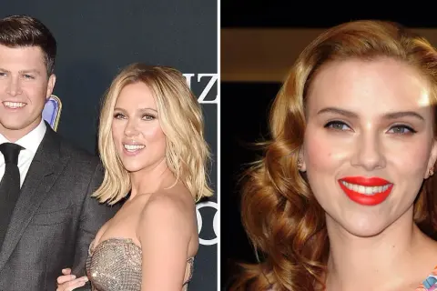 Scarlett Johansson and Colin Jost smiling on a red carpet.
