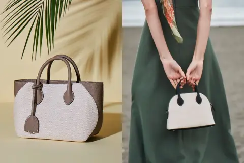 Två eleganta handväskor, en beige och brun tygväska med läderdetaljer, och en mindre vit kupolformad väska med svarta detaljer, som en baron necessär.