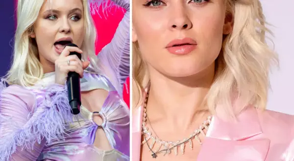 Zara Larsson, svensk popstjärna, med mikrofon och i rosa kavaj. Hennes zara larsson net worth är imponerande.