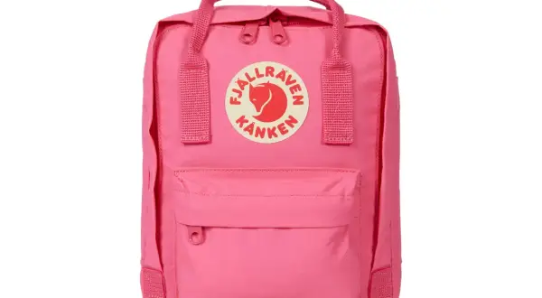 A pink Fjällräven Kånken Mini backpack with the brand's circular logo on the front.