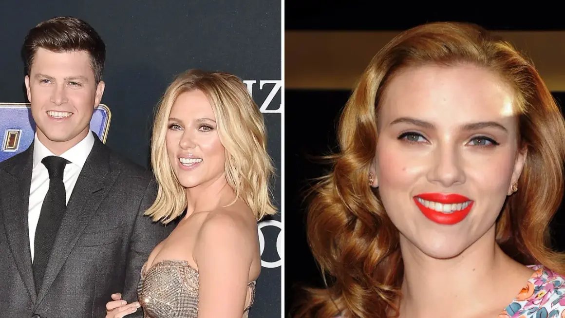Scarlett Johansson and Colin Jost smiling on a red carpet.
