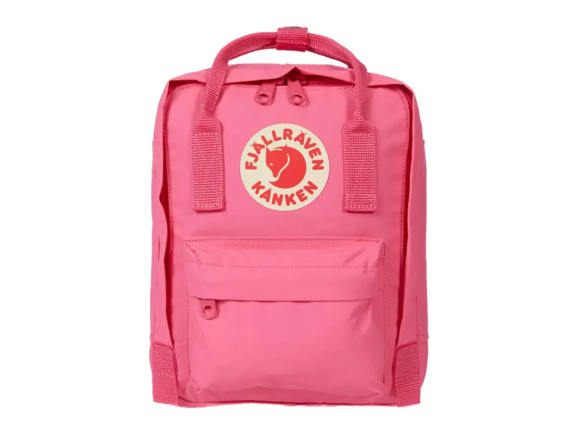 A pink Fjällräven Kånken Mini backpack with the brand's circular logo on the front.
