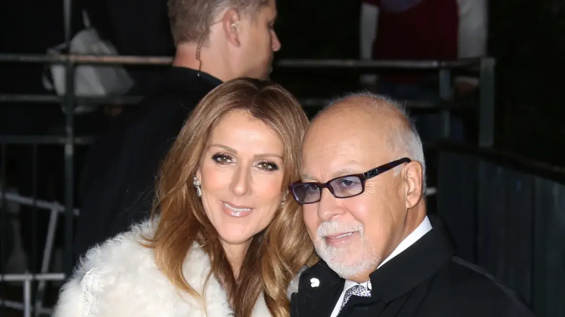 Celine Dion och en man med glasögon, en del av en säkerhetsvakt syns i bakgrunden.