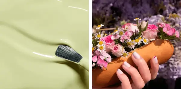 En pensel doppas i ljusgrönt nagellack. En hand med ljusa vårnaglar 2026 håller en orange form fylld med rosa blommor.